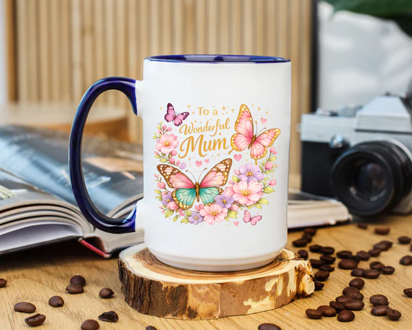 Two floral butterfly mugs sitting together with tea accents showing the botanical design