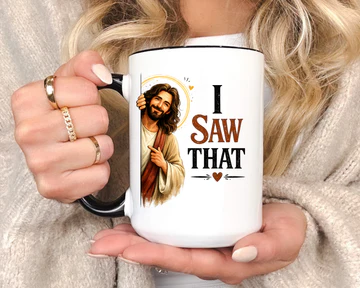 Side angle of the I Saw That mug showing the cheerful Jesus illustration peeking around the ceramic surface