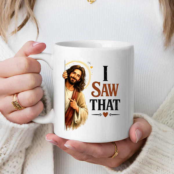 Close-up of the 'I Saw That' text and colorful Jesus cartoon graphic on a ceramic mug with a clean white background